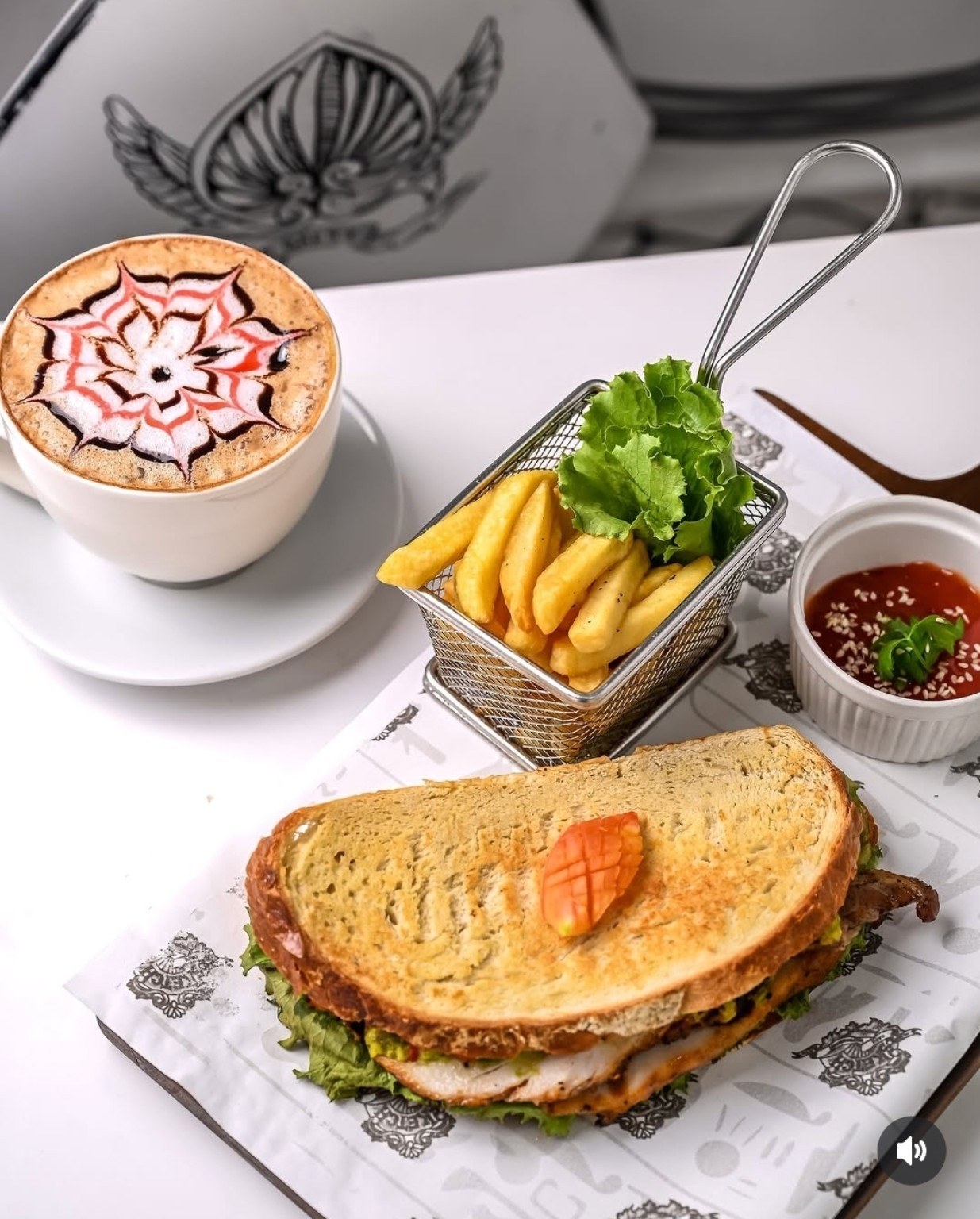 A toasted sandwich with fries at Sketch