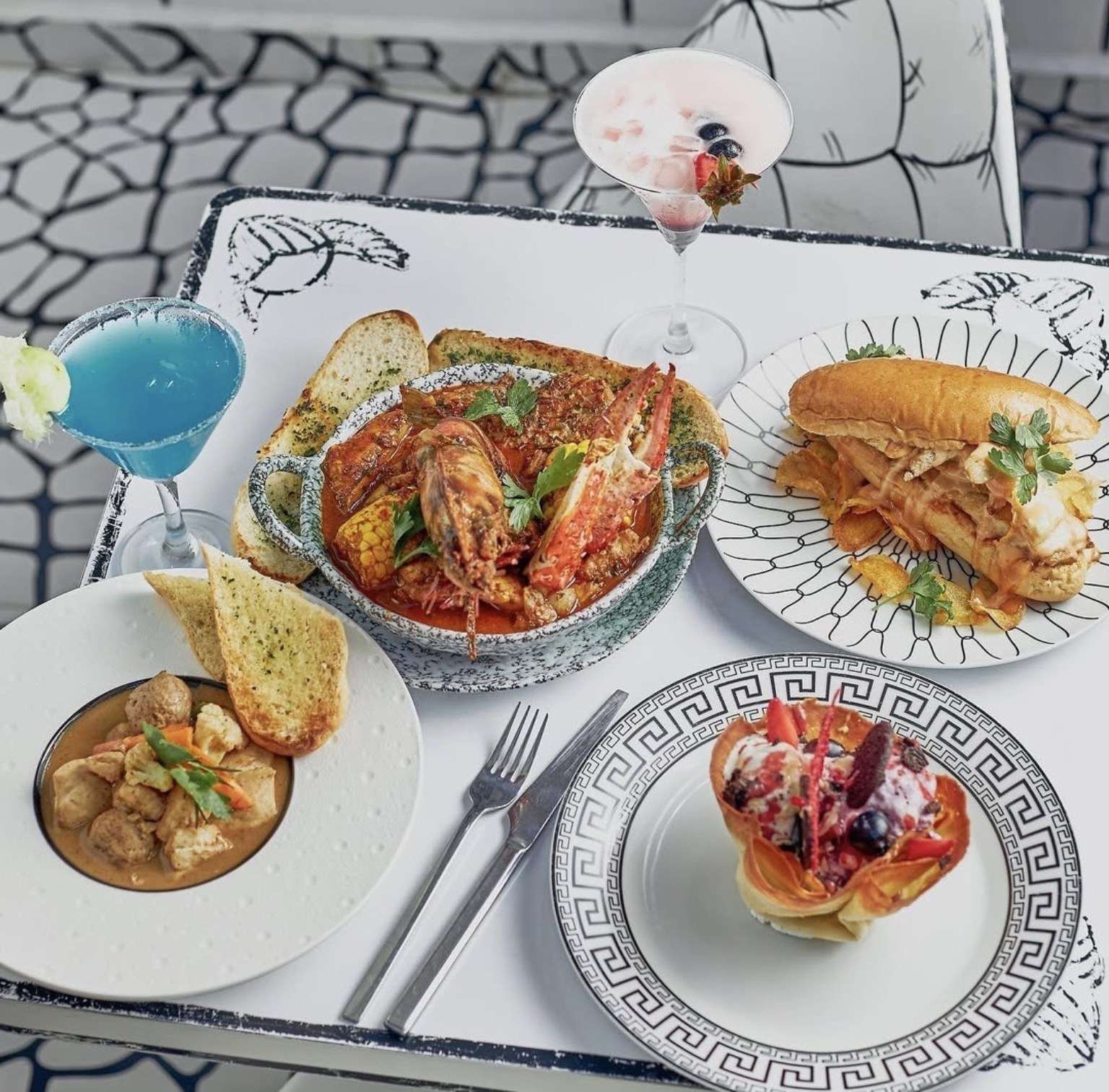 A table of Sketch dishes and drinks