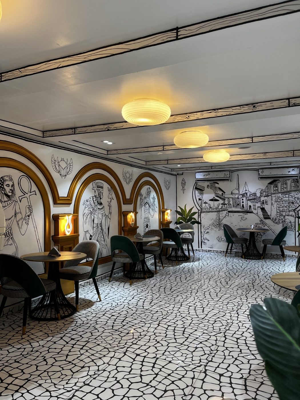 Sketch lounge with warm lights and wall art